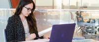 Student working on her laptop.